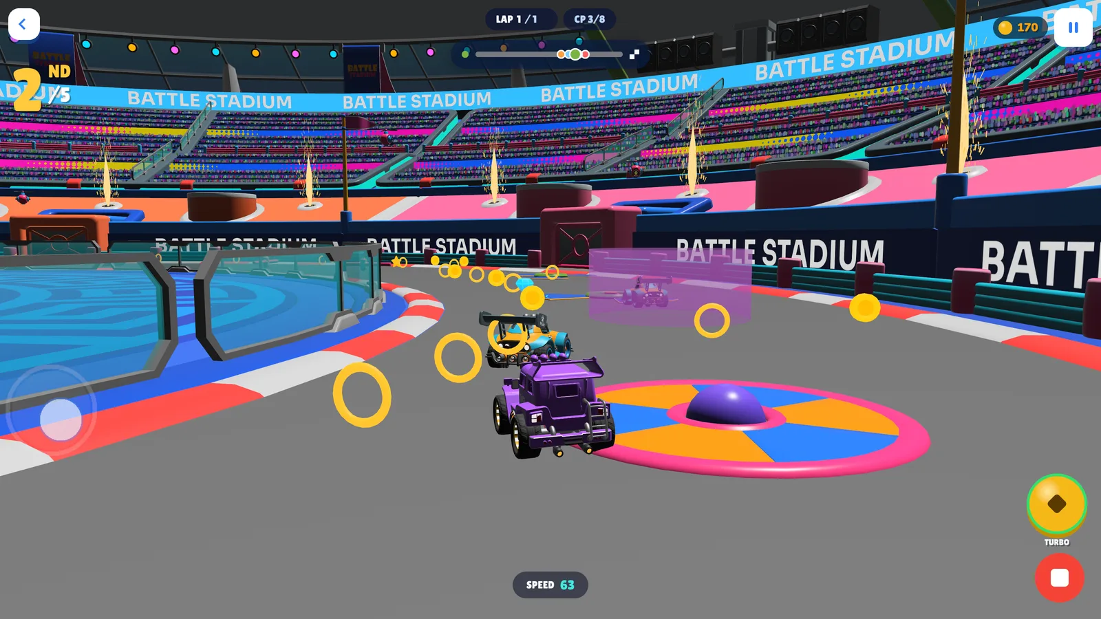 Two toy cars side by side in a bright stadium, chasing a line of gold rings past a spinning disc.